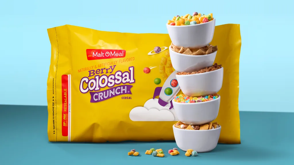 Berry Colossal Crunch Cereal packaging and stacked bowls